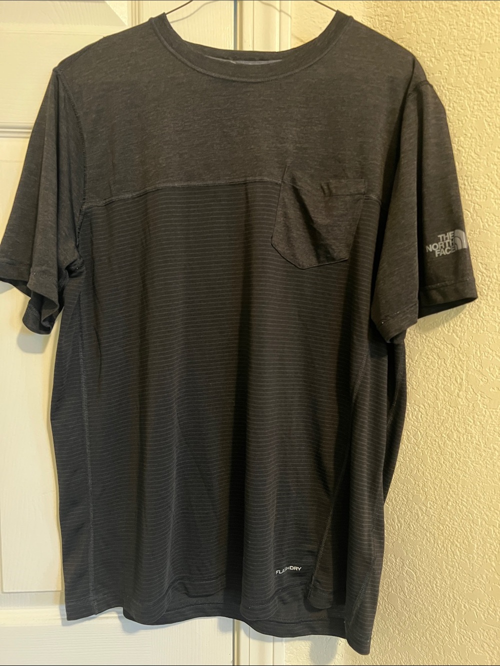 The North Face Mens Black Short Sleeve Pocket Tee with Subtle Stripe